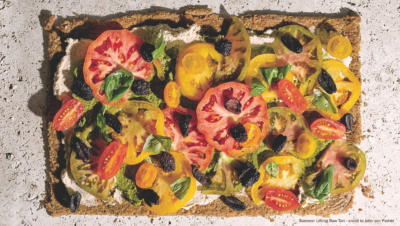 Bird's eye view of tart with tomatoes and olives